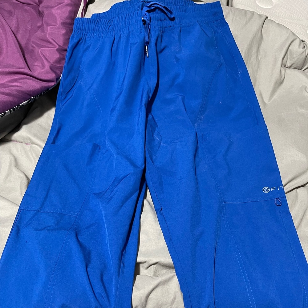 White cross ankle cuff scrub pants